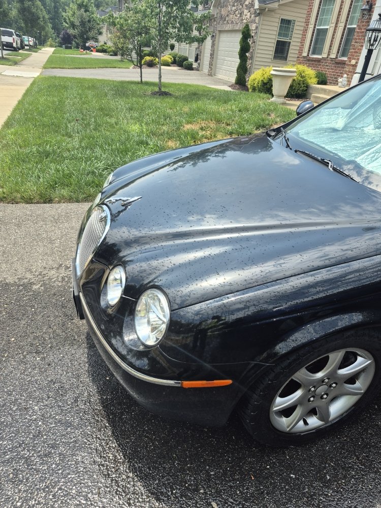 Luxury sedan on a residential street during a roadside call