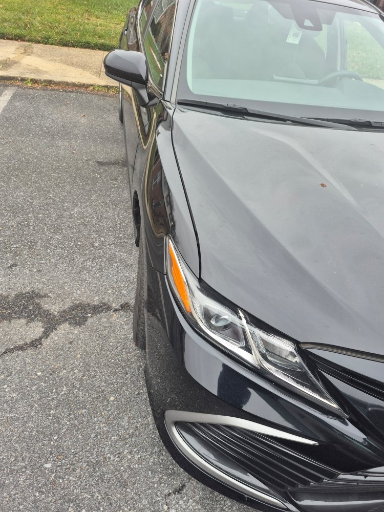 Sedan awaiting roadside assistance in a Maryland parking lot