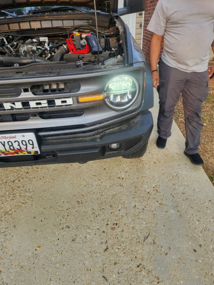 Battery jump start performed on a Ford Bronco during a roadside assistance call in Maryland